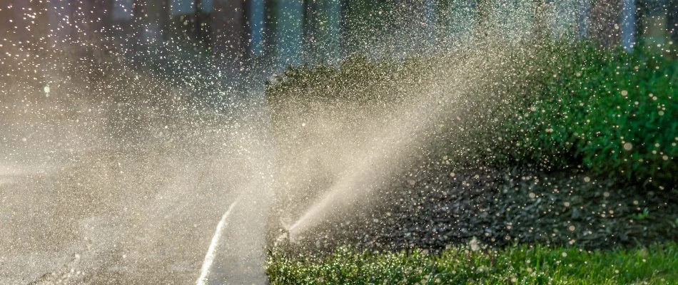 Sprinkler watering a commercial landscape in Ann Arbor, MI.